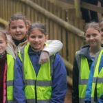Education-children-smiling-at-the-camera-high-res-landscape-1920x1080
