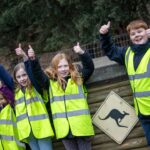 School Group Children arms in the air Wallaby Enclosure